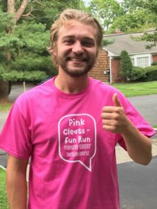man in pink shirt